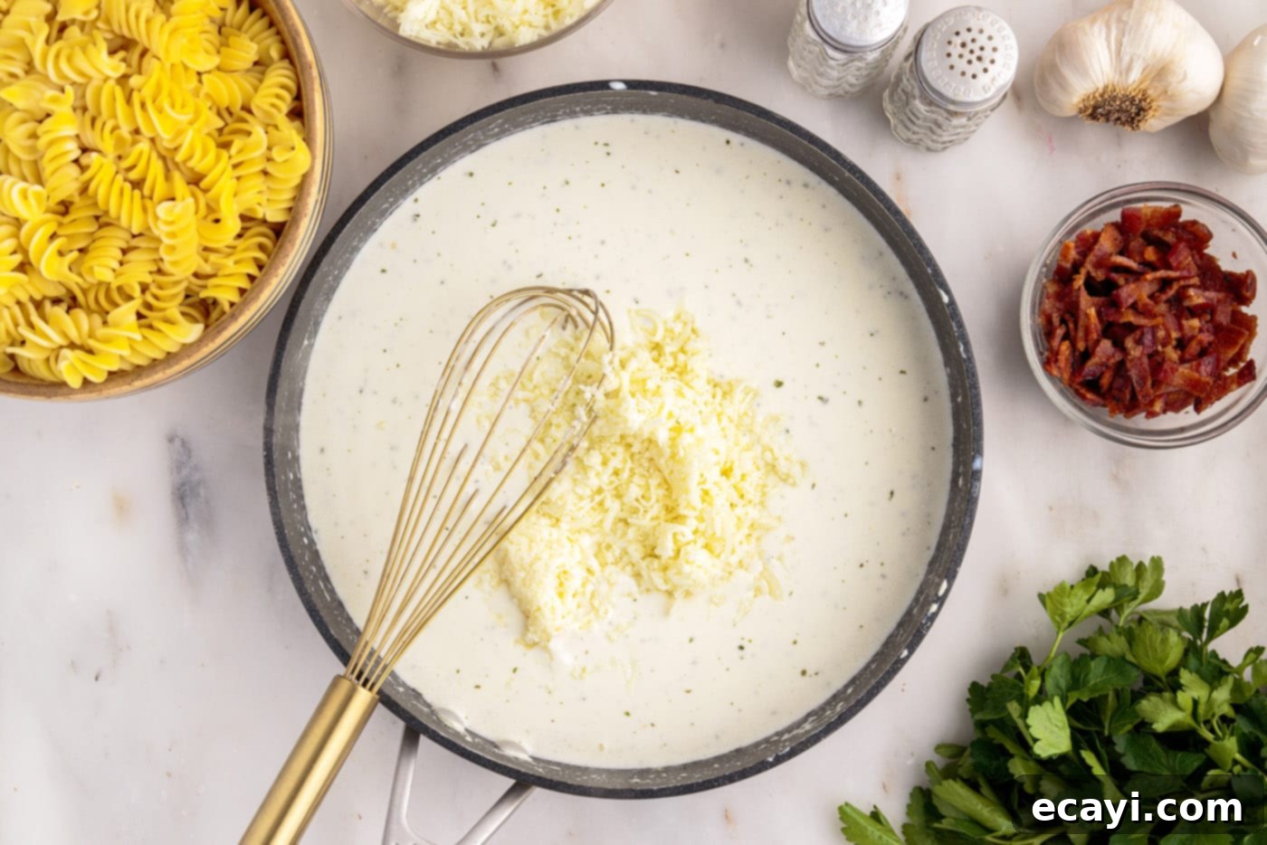 Creamy Chicken Bacon Ranch Bake 9 whisking cheese into cream cheese mixture in a skillet