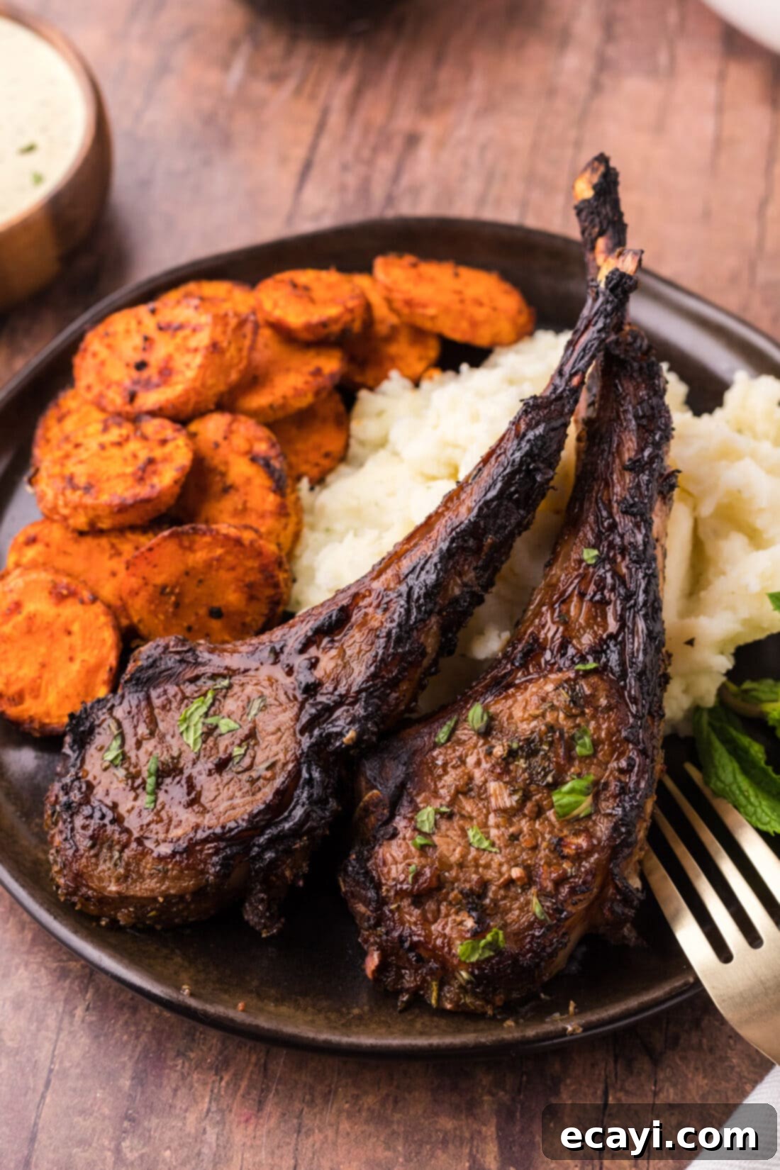 Succulent Broiled Lamb Chops 2 Two Broiled Lamb Chops on a plate with carrots and mashed potatoes