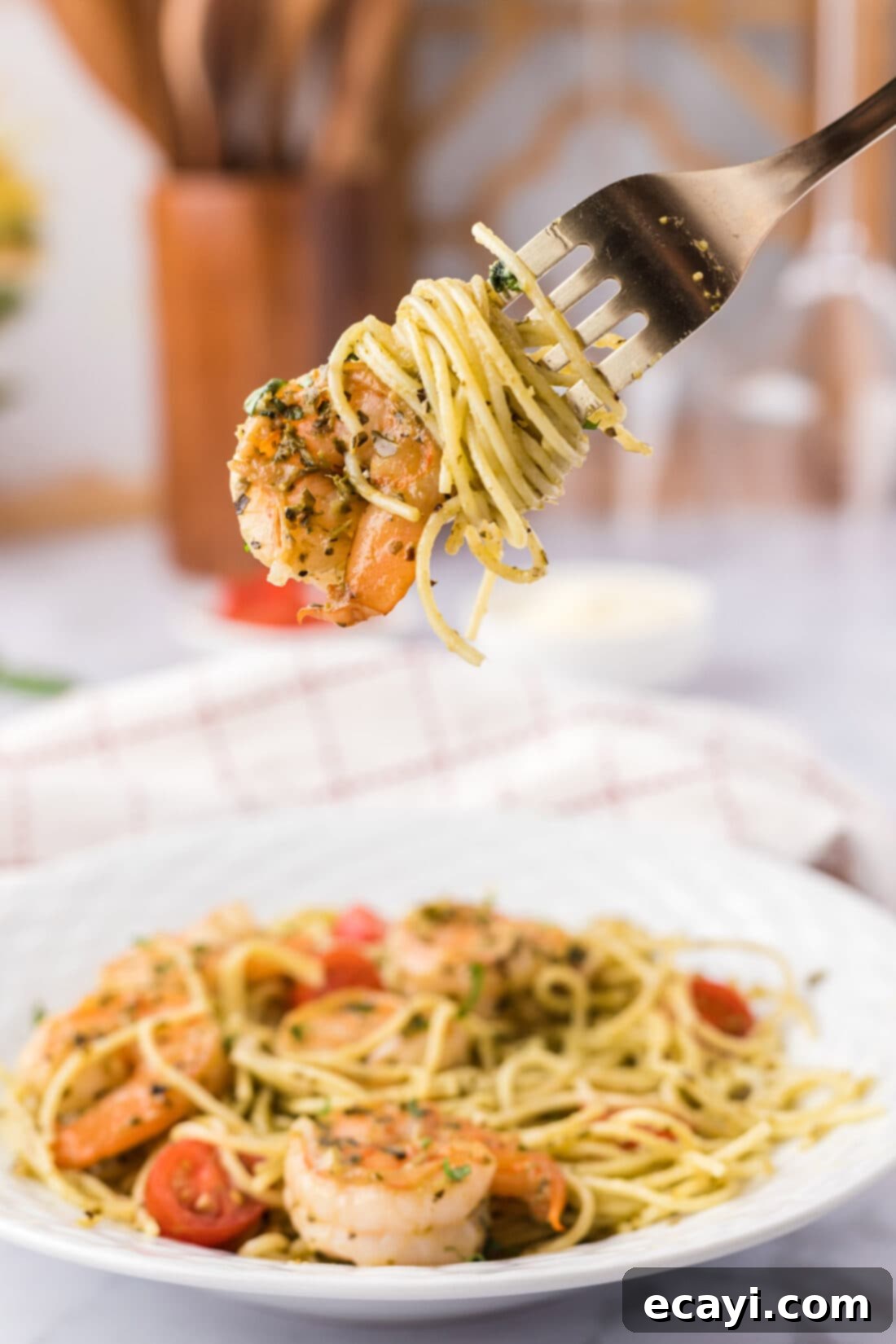 Vibrant Pesto Prawn Pasta 3 Shrimp Pesto Pasta being picked up by a fork