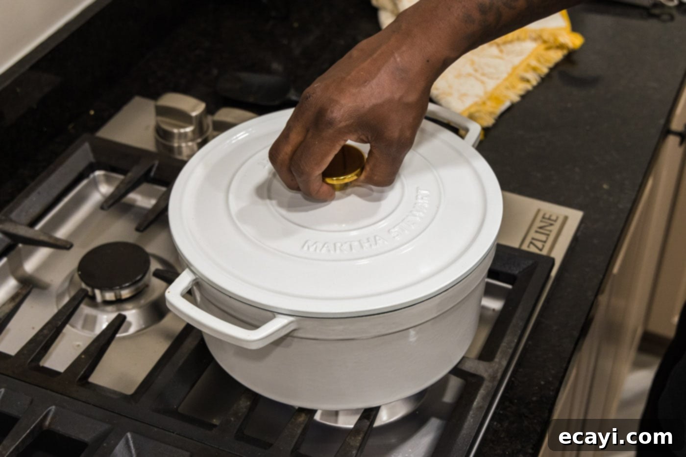 Savory Slow-Braised Beef 15 placing lid on dutch oven