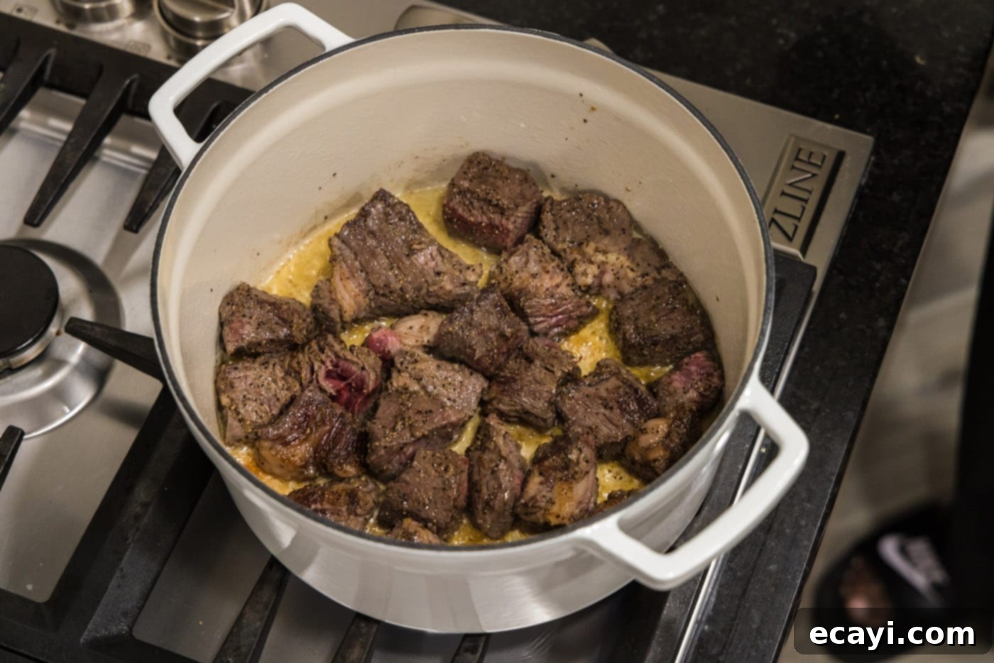 Savory Slow-Braised Beef 8 seared beef chuck roast in a dutch oven