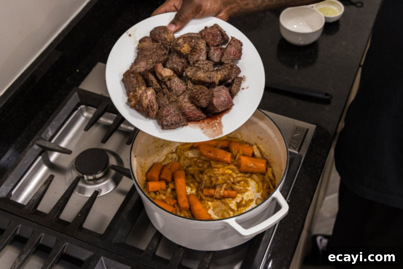 Savory Slow-Braised Beef 10 adding beef back to dutch oven with carrots and onions