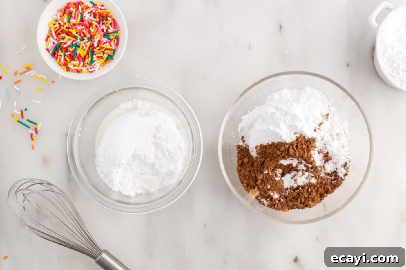 Effortless Cake Mix Donuts 11 cocoa powder and powdered sugar in a bowl next to powdered sugar and milk in a bowl