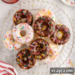 Effortless Cake Mix Donuts 17 Cake Mix Donuts stacked on a glass plate