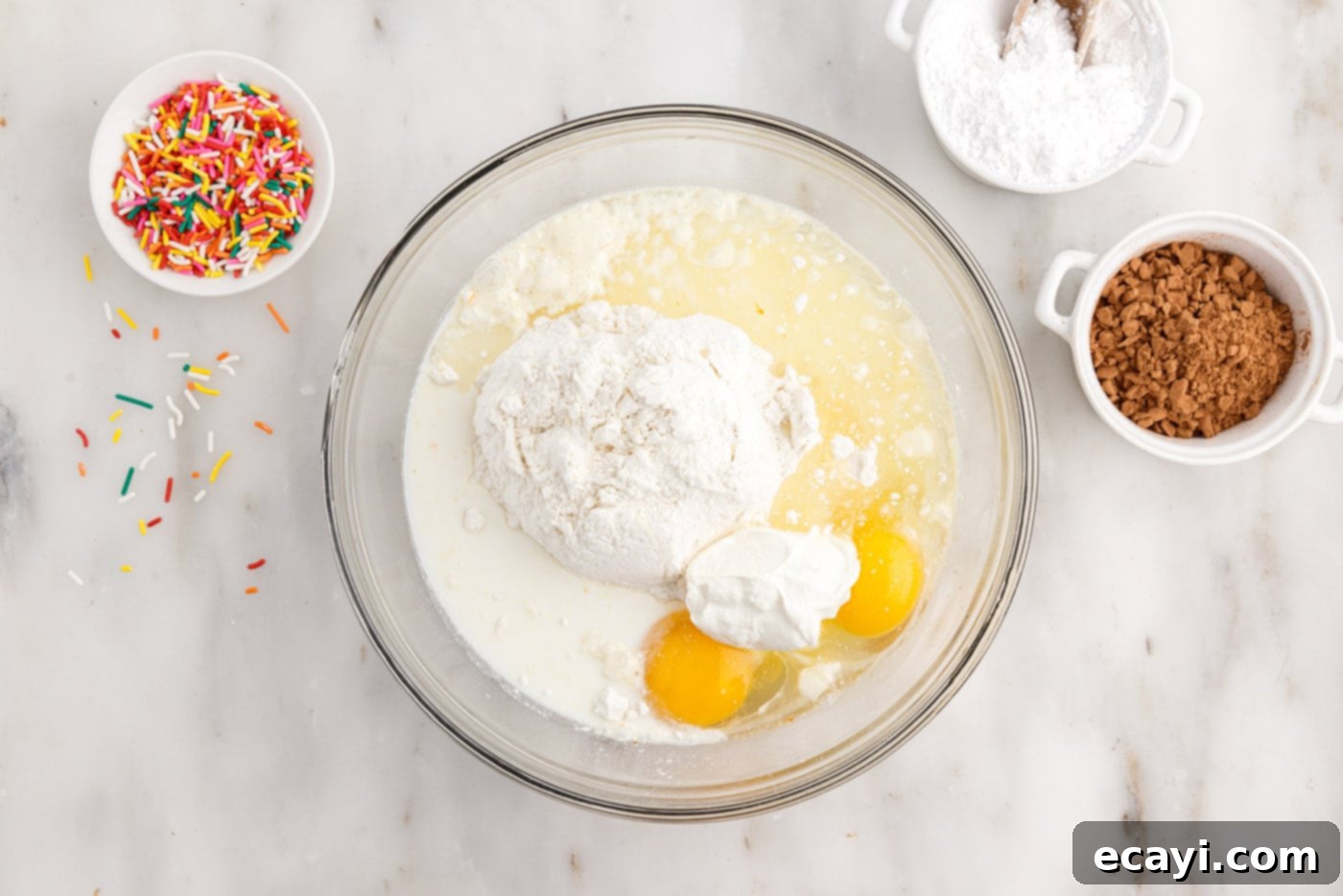 Effortless Cake Mix Donuts 5 cake mix donut ingredients in a large mixing bowl