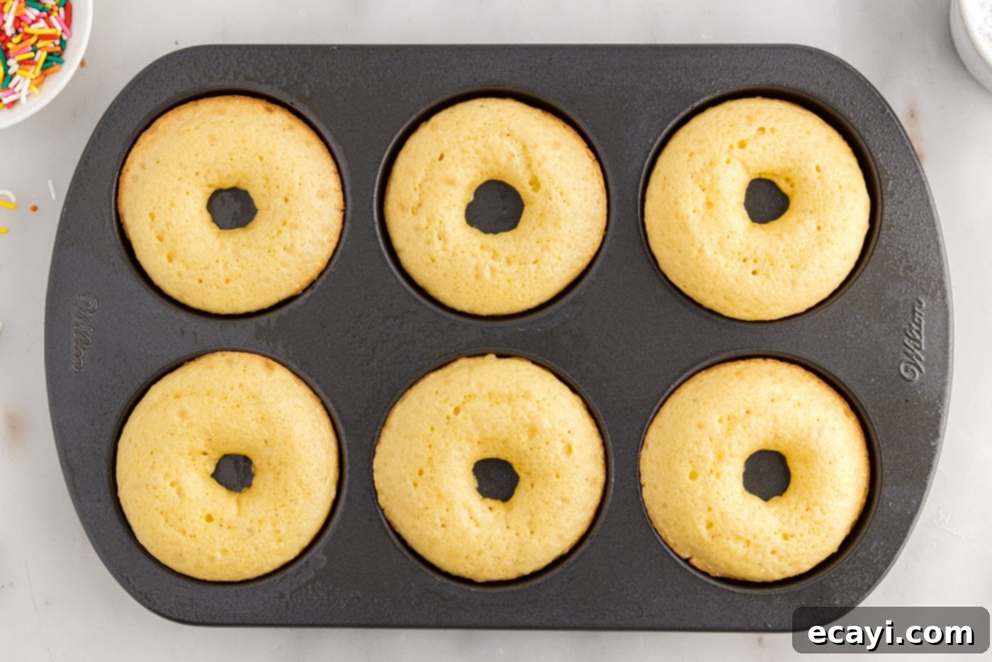 Effortless Cake Mix Donuts 9 baked cake mix donuts in a pan