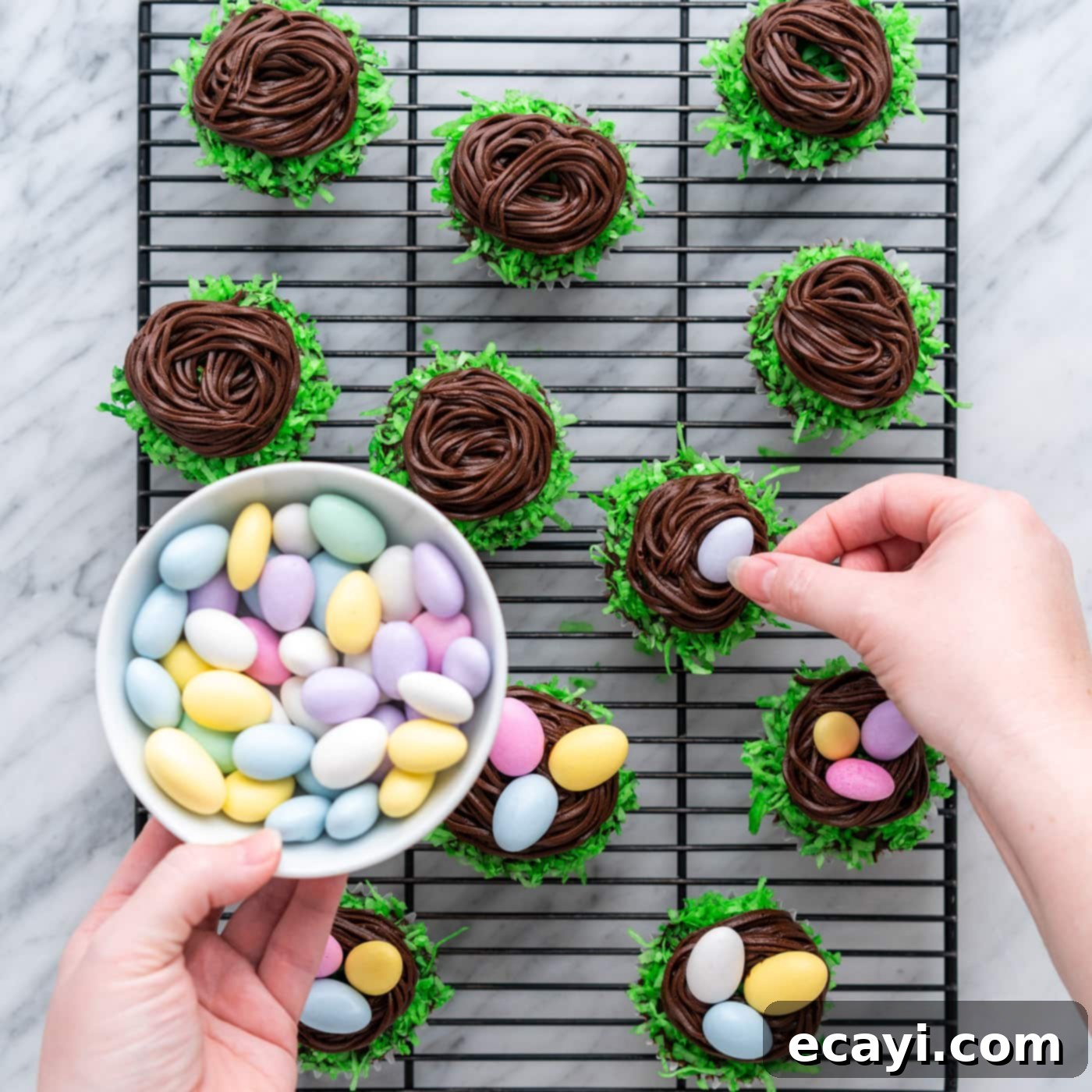 Springtime Nest Delights 13 adding chocolate egg candy to easter nest cupcakes