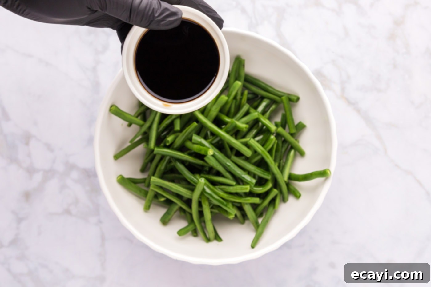 Crispy Roasted Green Beans 6 soy sauce over green beans in a bowl