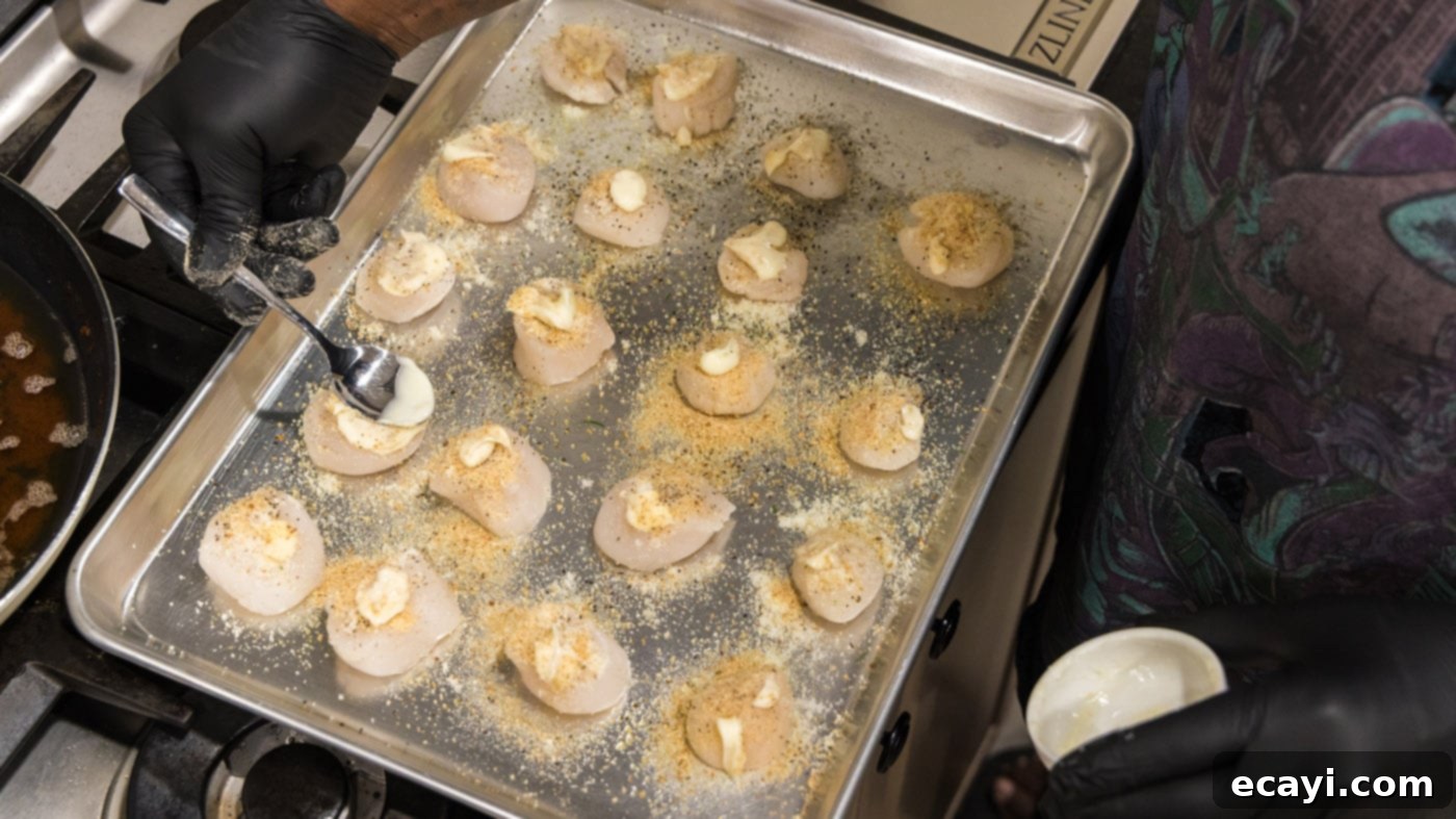 Golden Baked Scallops 9 Gently brushing softened butter onto the breadcrumb and cheese topping of the scallops.
