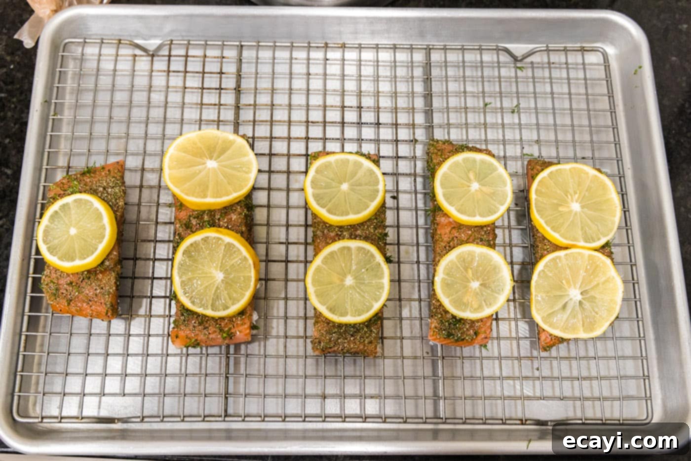 Zesty Dill Salmon 8 lemon slices on top of dill salmon