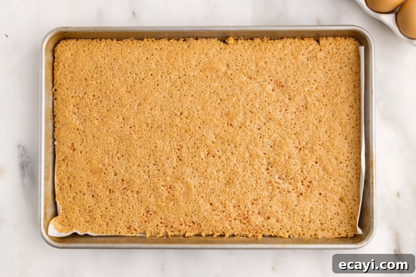 Swirled Carrot Delight 10 Freshly baked carrot cake roll, evenly browned and removed from the oven.