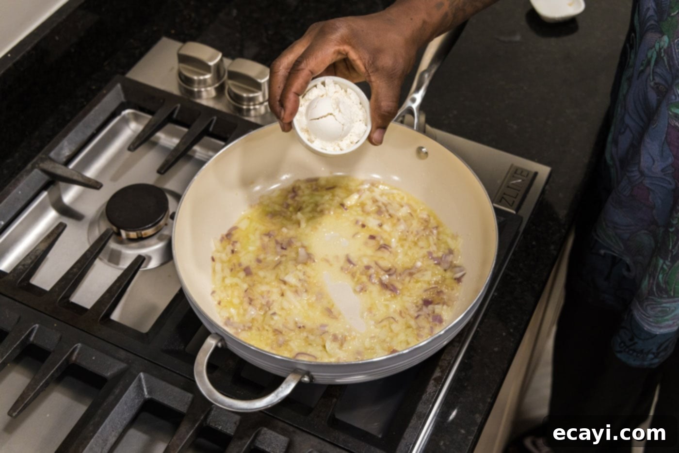Crawfish Etouffee: A Taste of Louisiana 6 adding flour to skillet to make a roux