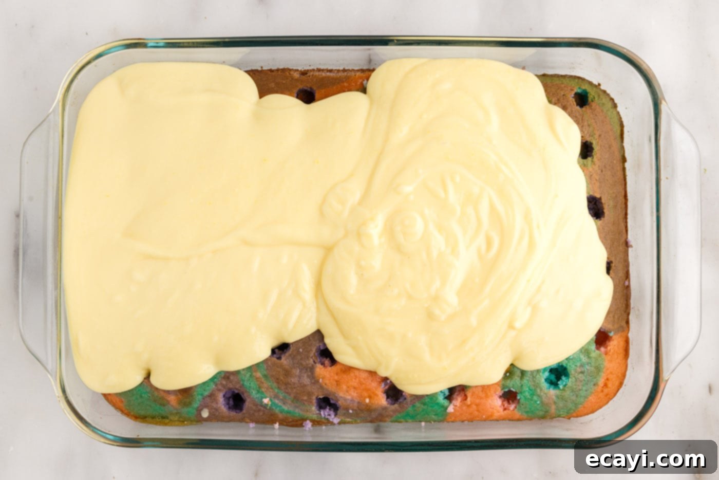 Springtime Poke Cake Delight 15 vanilla pudding on top of poke cake