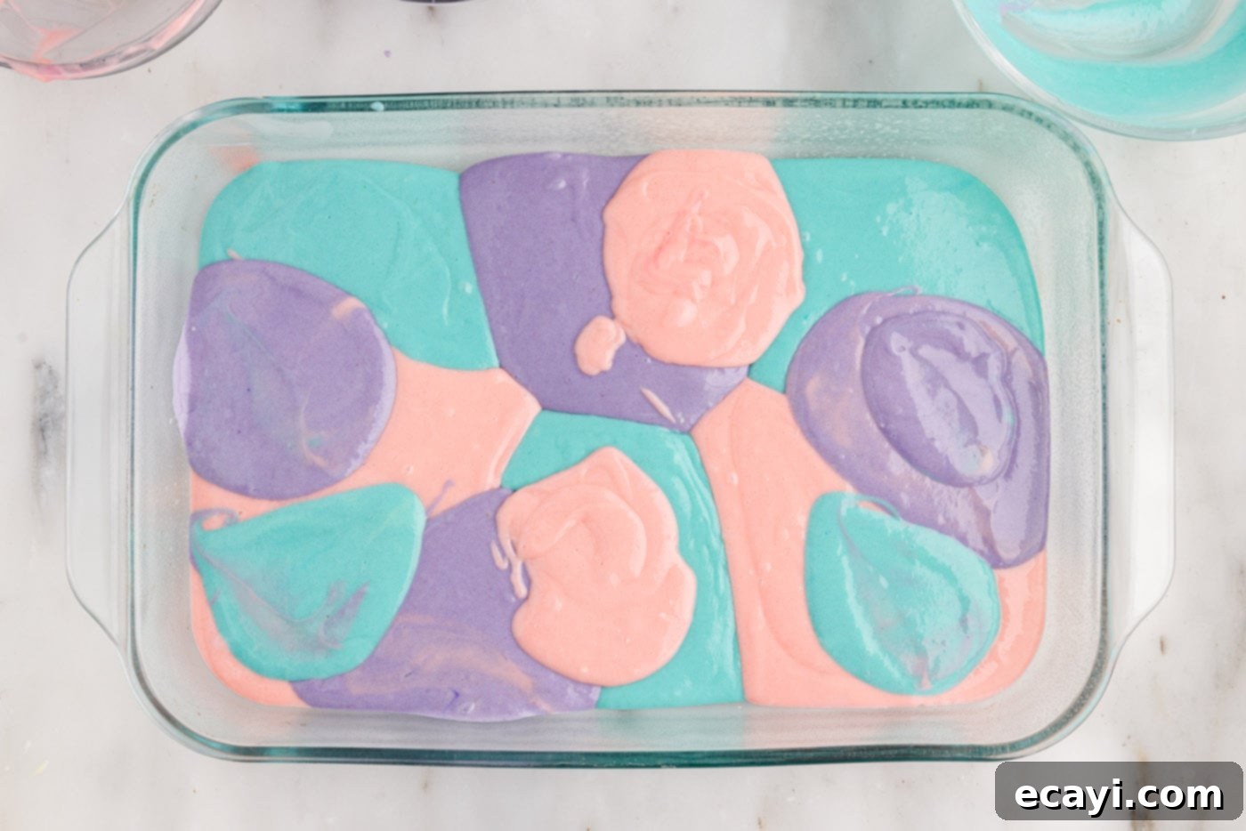 Springtime Poke Cake Delight 9 pastel colored cake batter in a baking dish