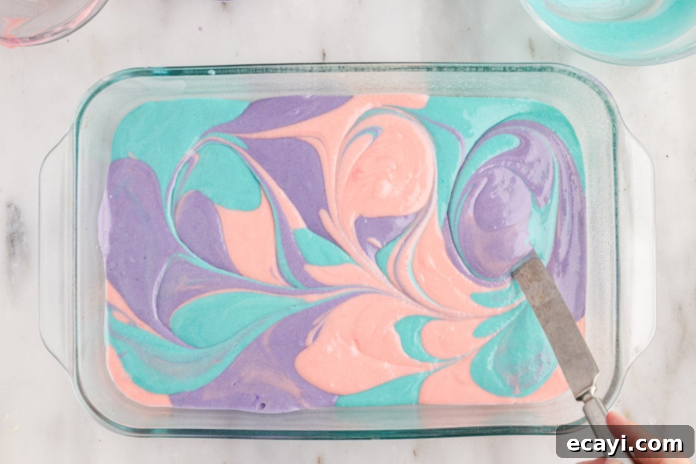Springtime Poke Cake Delight 10 gently swirling colorful cake batter together