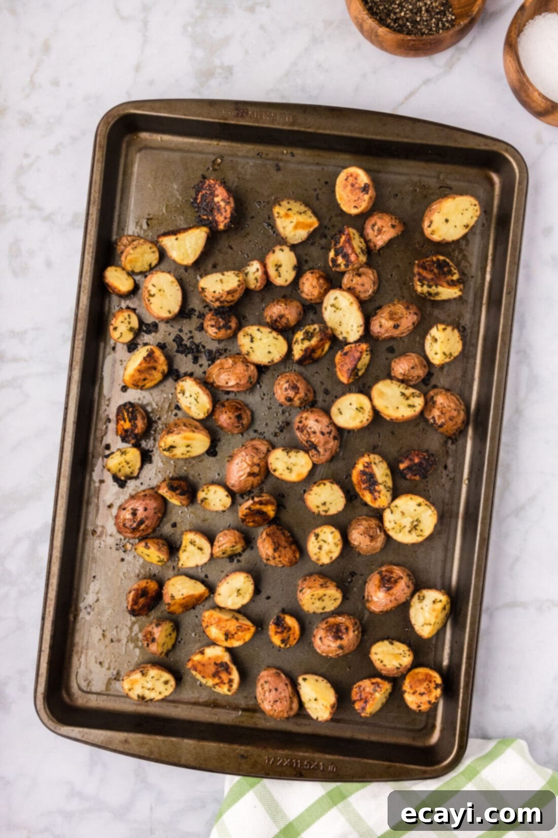 Crispy Roasted Red Potato Medley 3 Roasted Red Potatoes fresh out of the oven on a sheet pan, golden and ready to serve