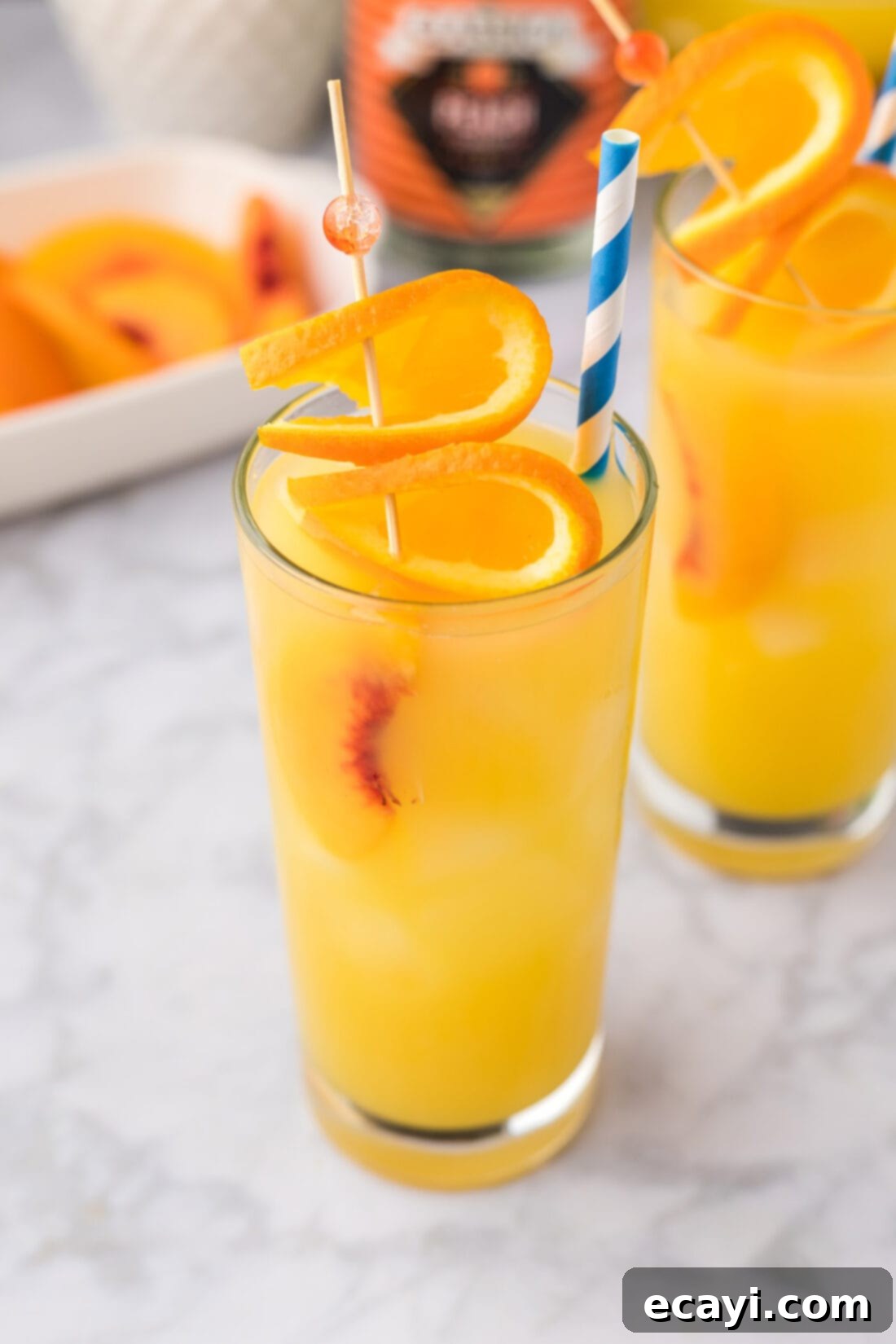 Golden Peach Nectar 3 Close up photo of a Fuzzy Navel cocktail in a tall glass