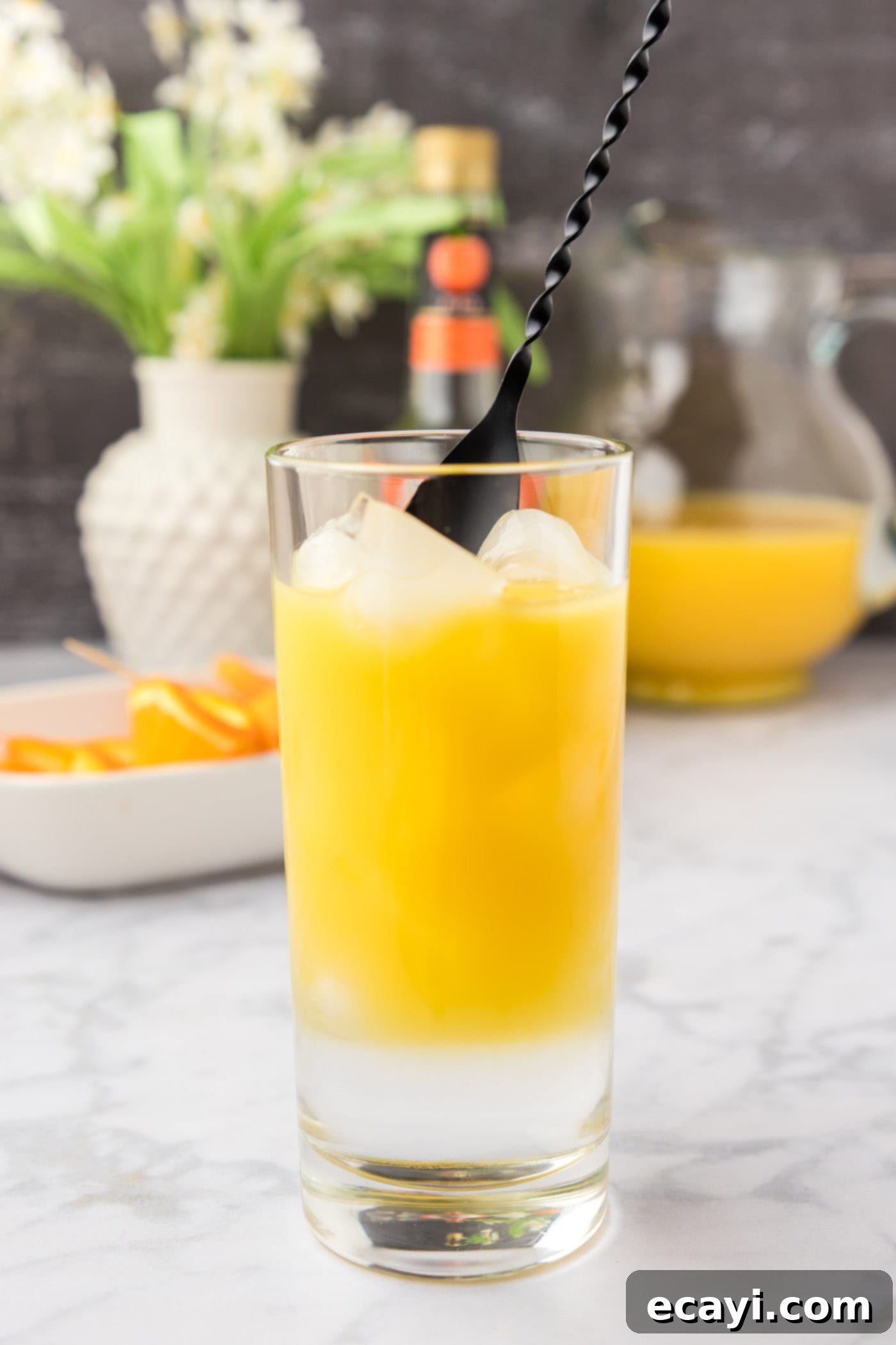 Golden Peach Nectar 7 mixing fuzzy navel cocktail in a glass