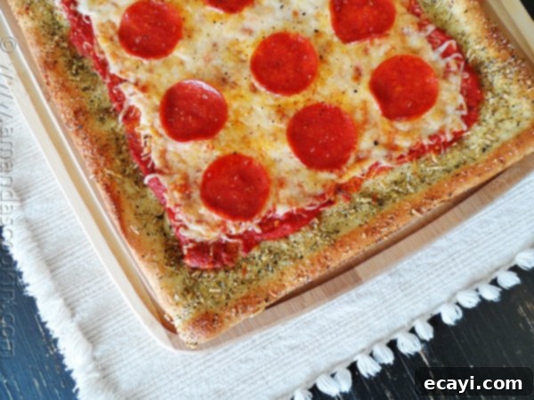 Classic Pizza with Garlic Bread Crust 2 A close up overhead photo of garlic bread crusted classic pizza.