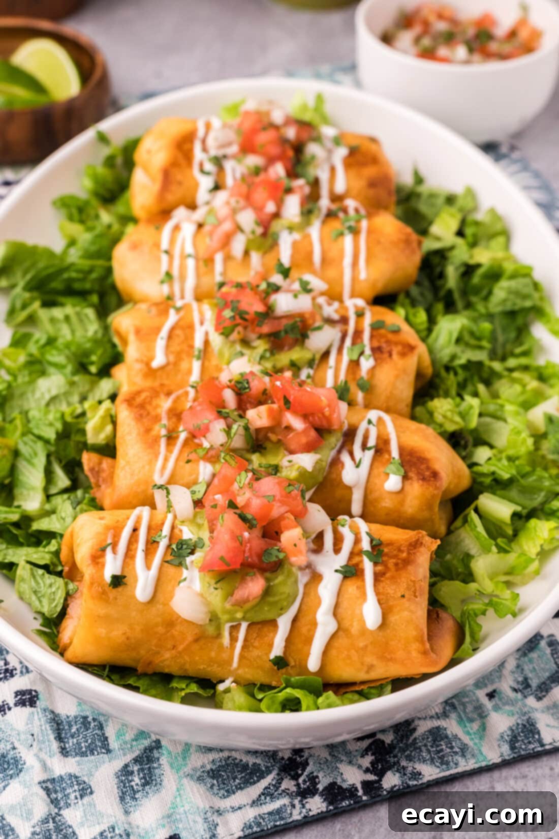 Chimichanga Perfection 2 Crispy chicken chimichangas served over a bed of fresh lettuce