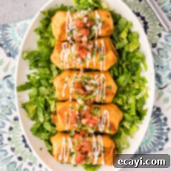 Chimichanga Perfection 22 Chimichangas served over a bed of lettuce on a serving platter