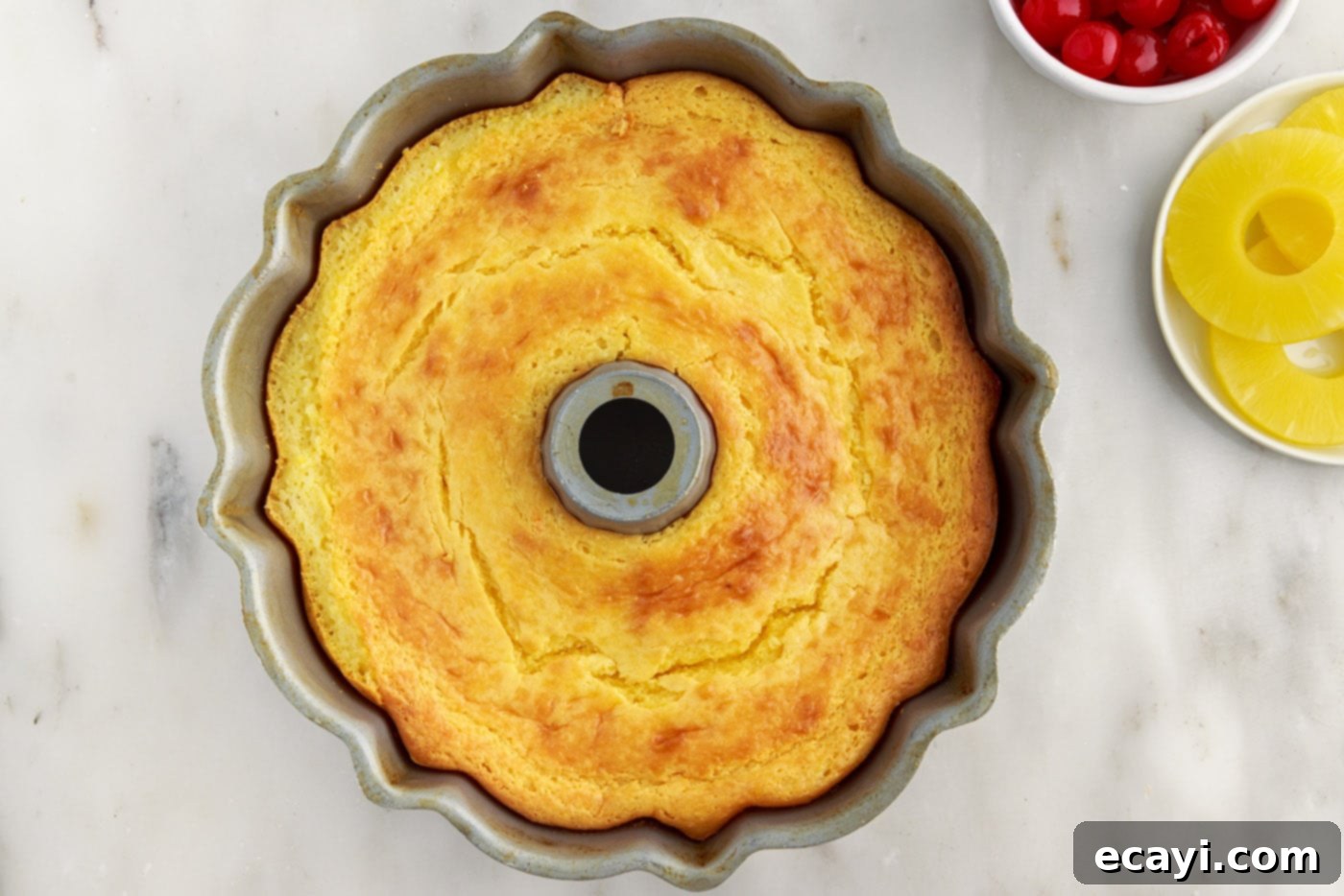 Golden Pineapple Crown Bundt Cake 13 baked pineapple bundt cake in a pan
