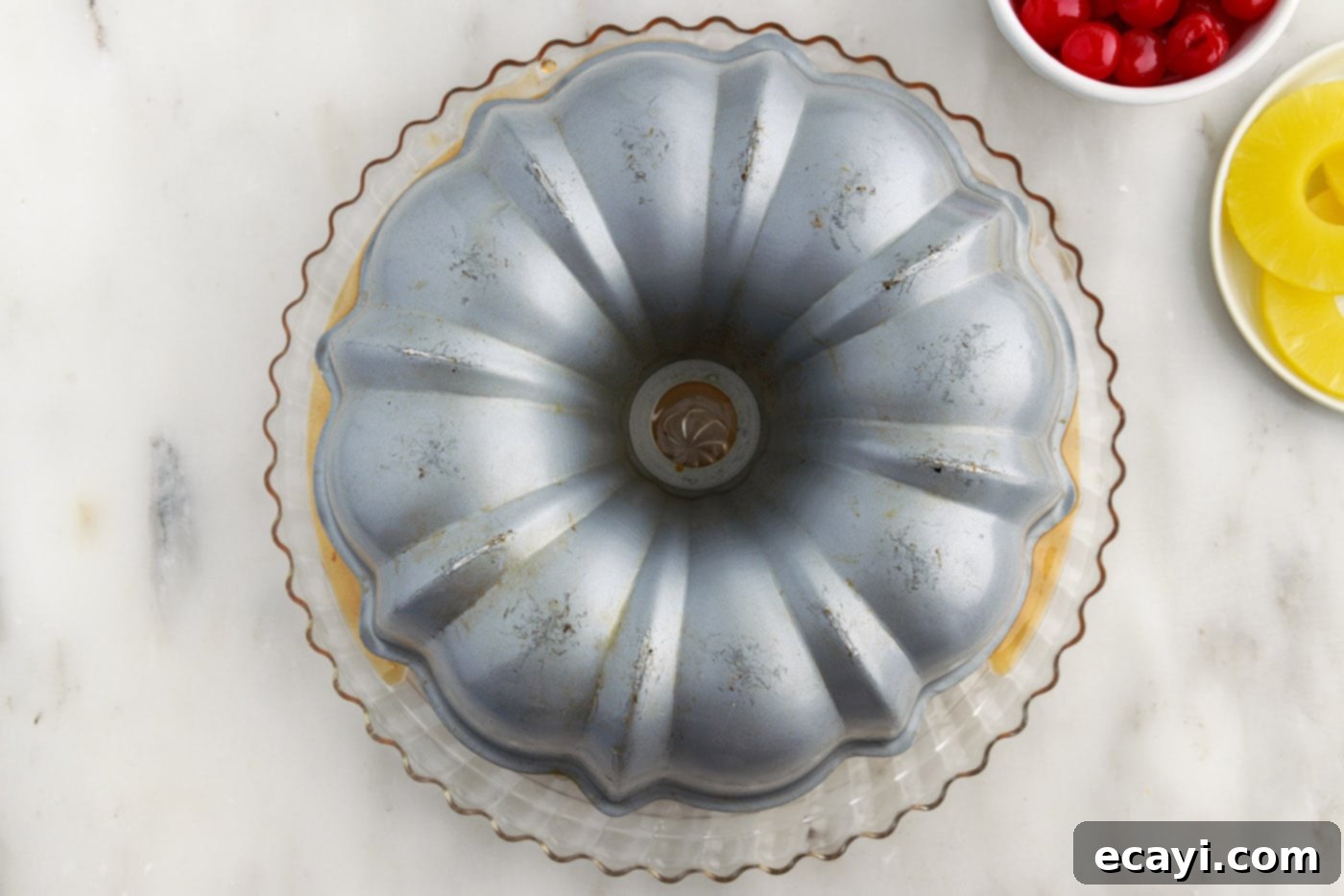Golden Pineapple Crown Bundt Cake 14 turning bundt cake pan inverted on a plate