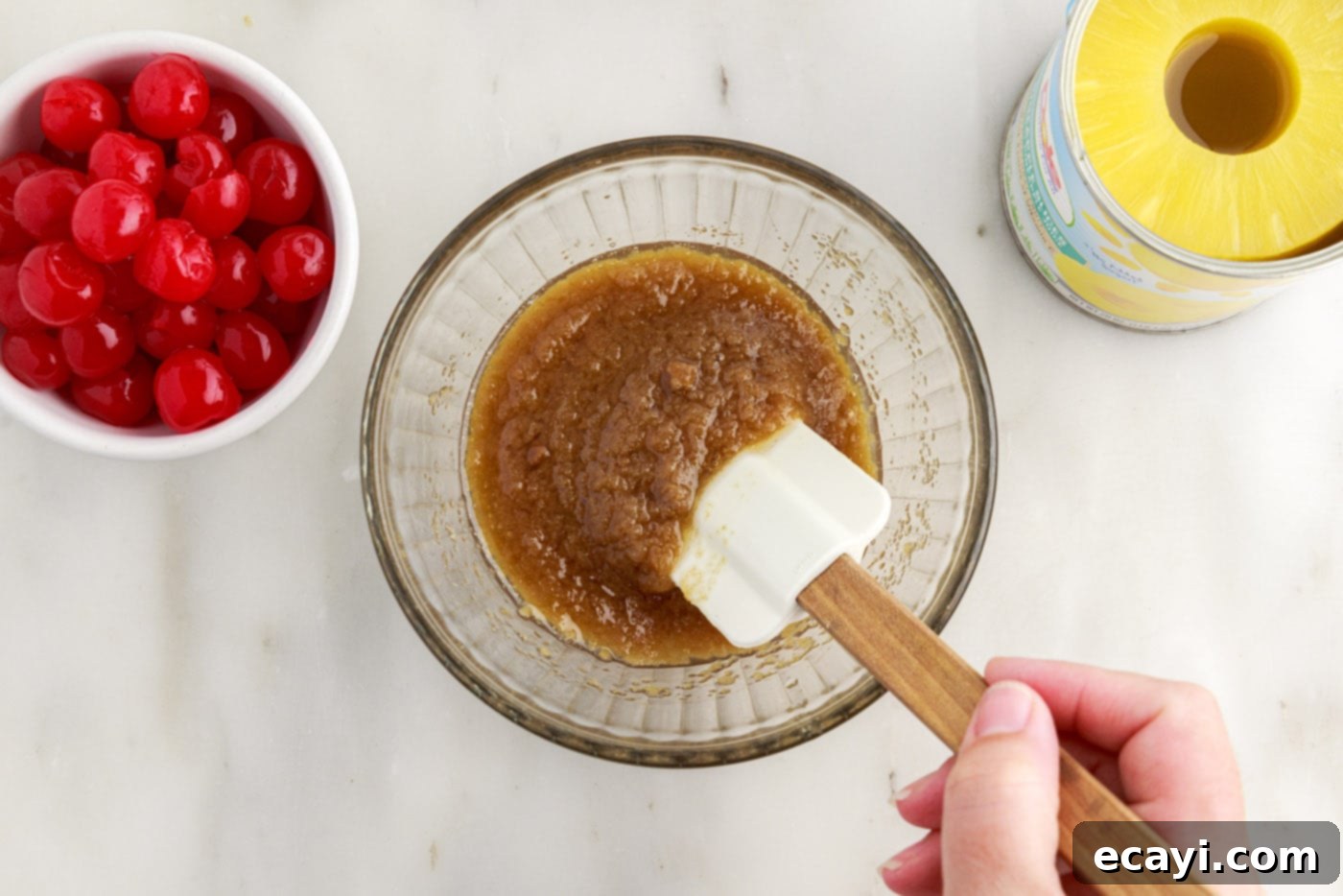 Golden Pineapple Crown Bundt Cake 5 mixing brown sugar and butter in a bowl