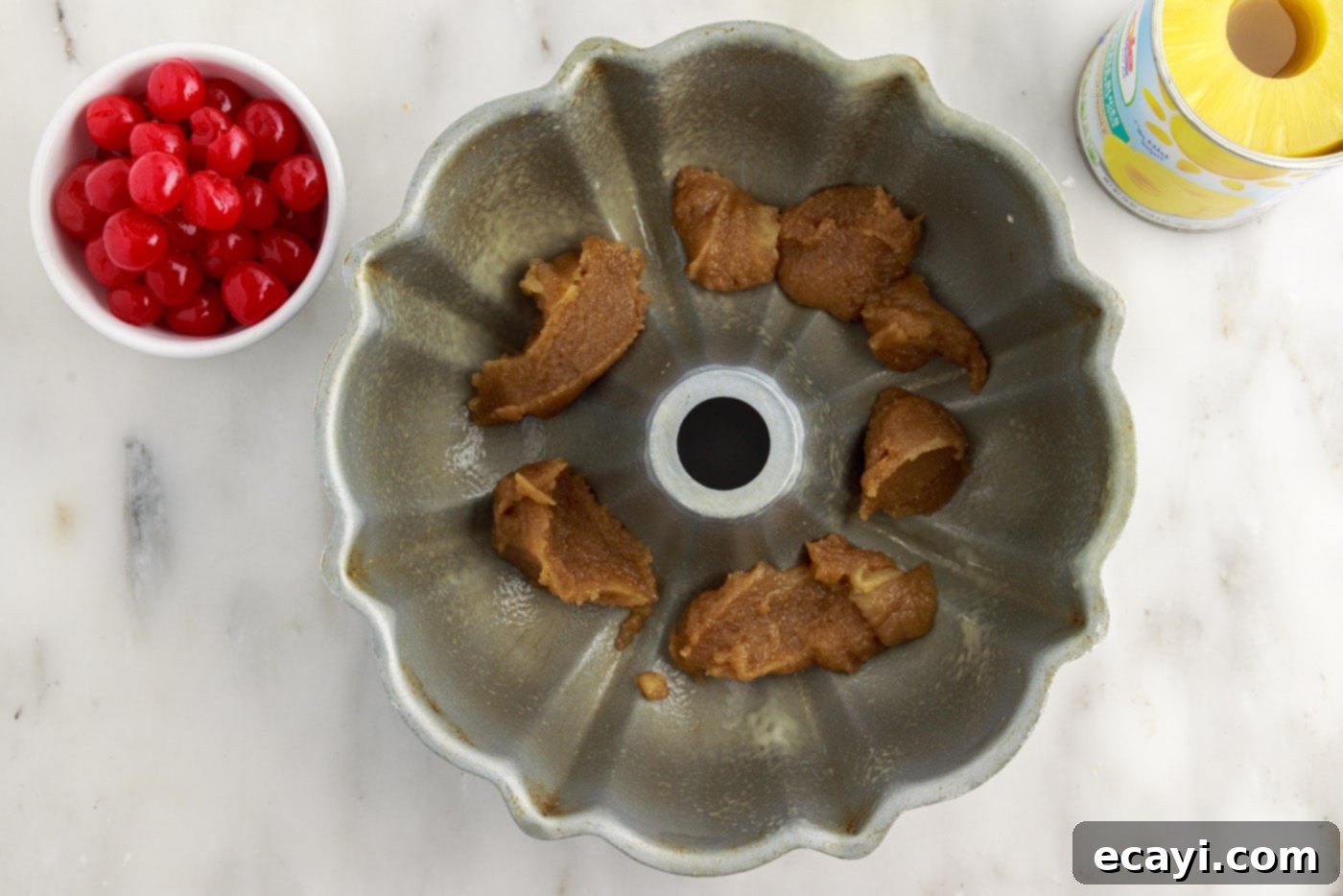 Golden Pineapple Crown Bundt Cake 6 brown sugar mixture in bottom of bundt cake pan