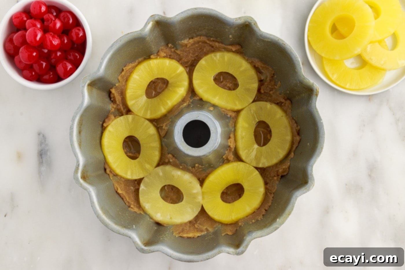 Golden Pineapple Crown Bundt Cake 8 pineapple rings on top of brown sugar mixture