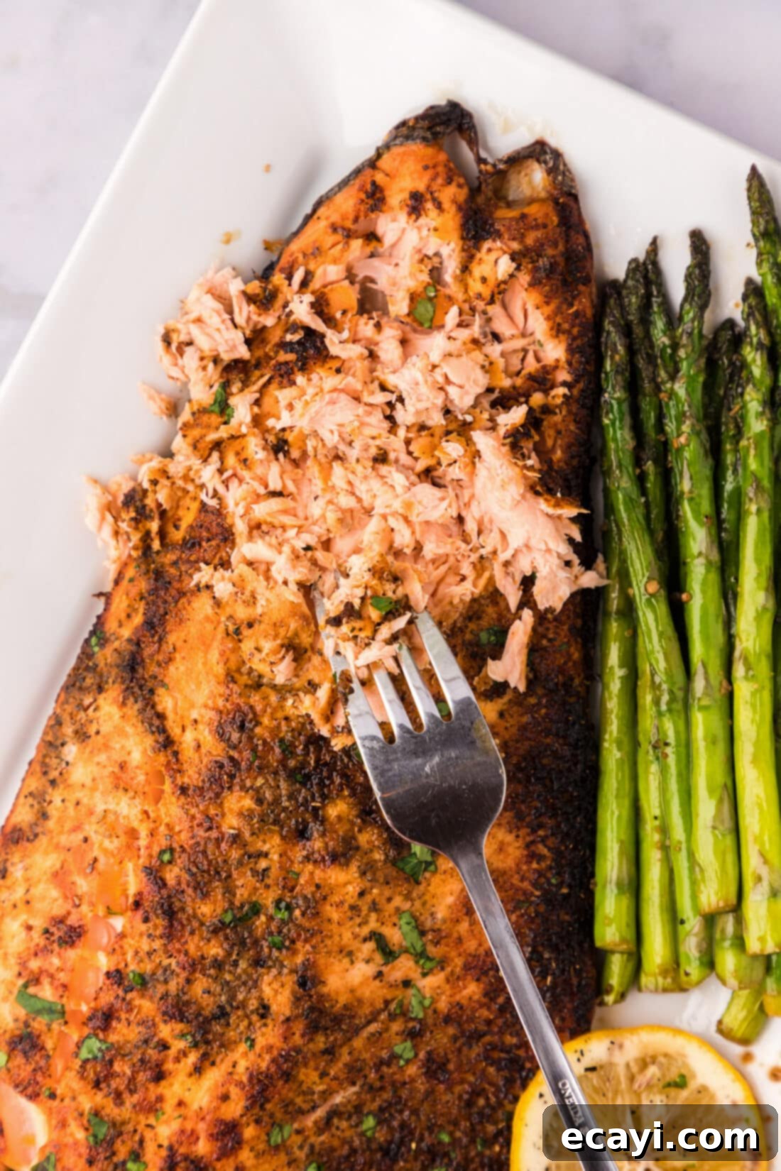 Perfectly Broiled Salmon 9 Close up photo of Broiled Salmon shredded by a fork