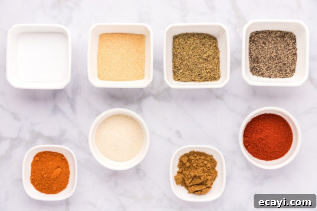 Spicy Louisiana Blend 4 Various spices laid out on a surface, which are the ingredients for making Cajun seasoning, including red paprika, black pepper, and other dry spices.