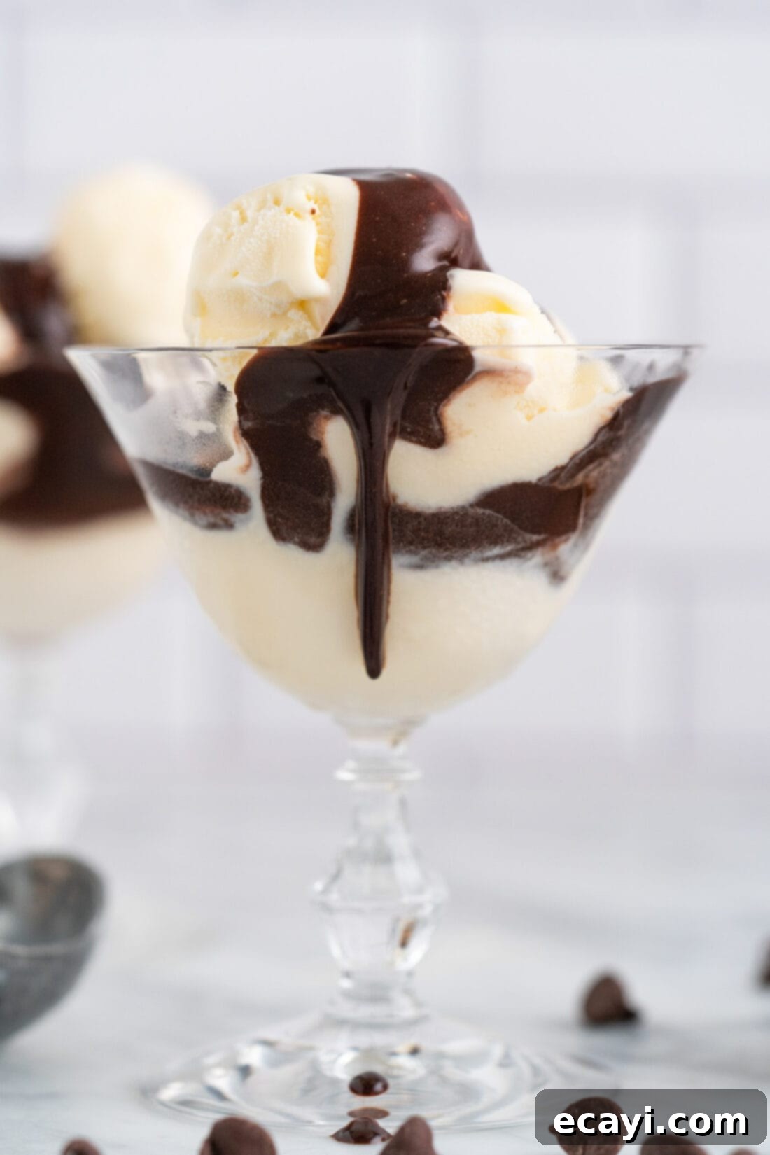 Decadent Chocolate Drizzle 2 Ice cream in a sundae glass with Hot Fudge on top