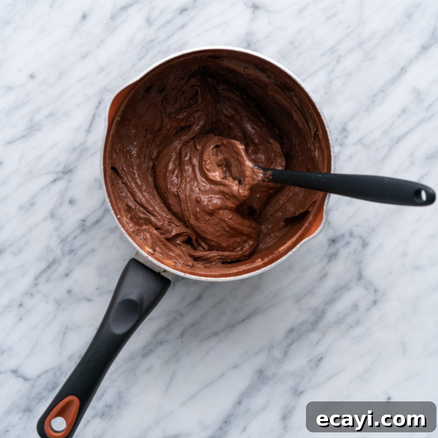 Decadent Chocolate Drizzle 6 chocolate mixture stirred in a saucepan