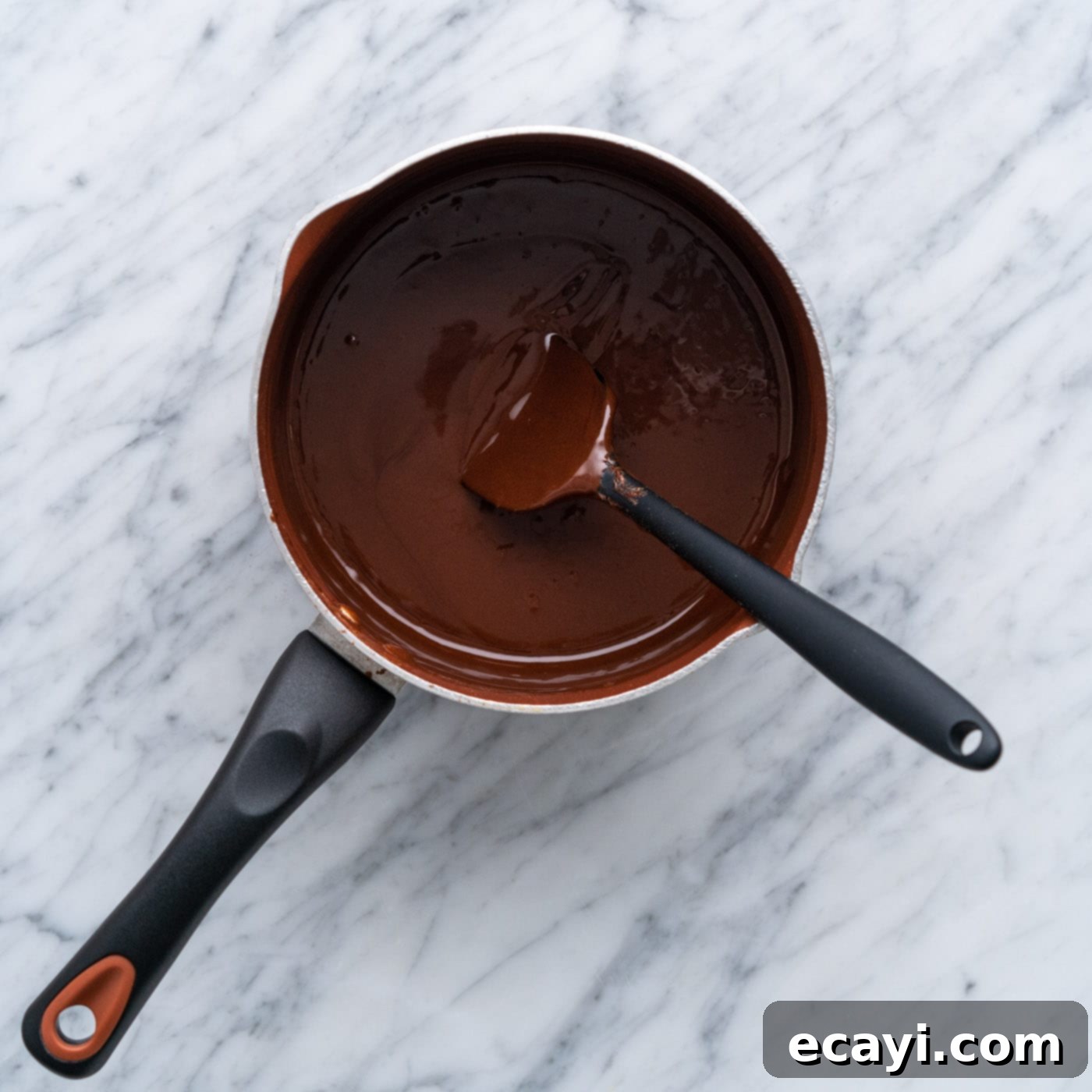 Decadent Chocolate Drizzle 7 homemade hot fudge in a saucepan