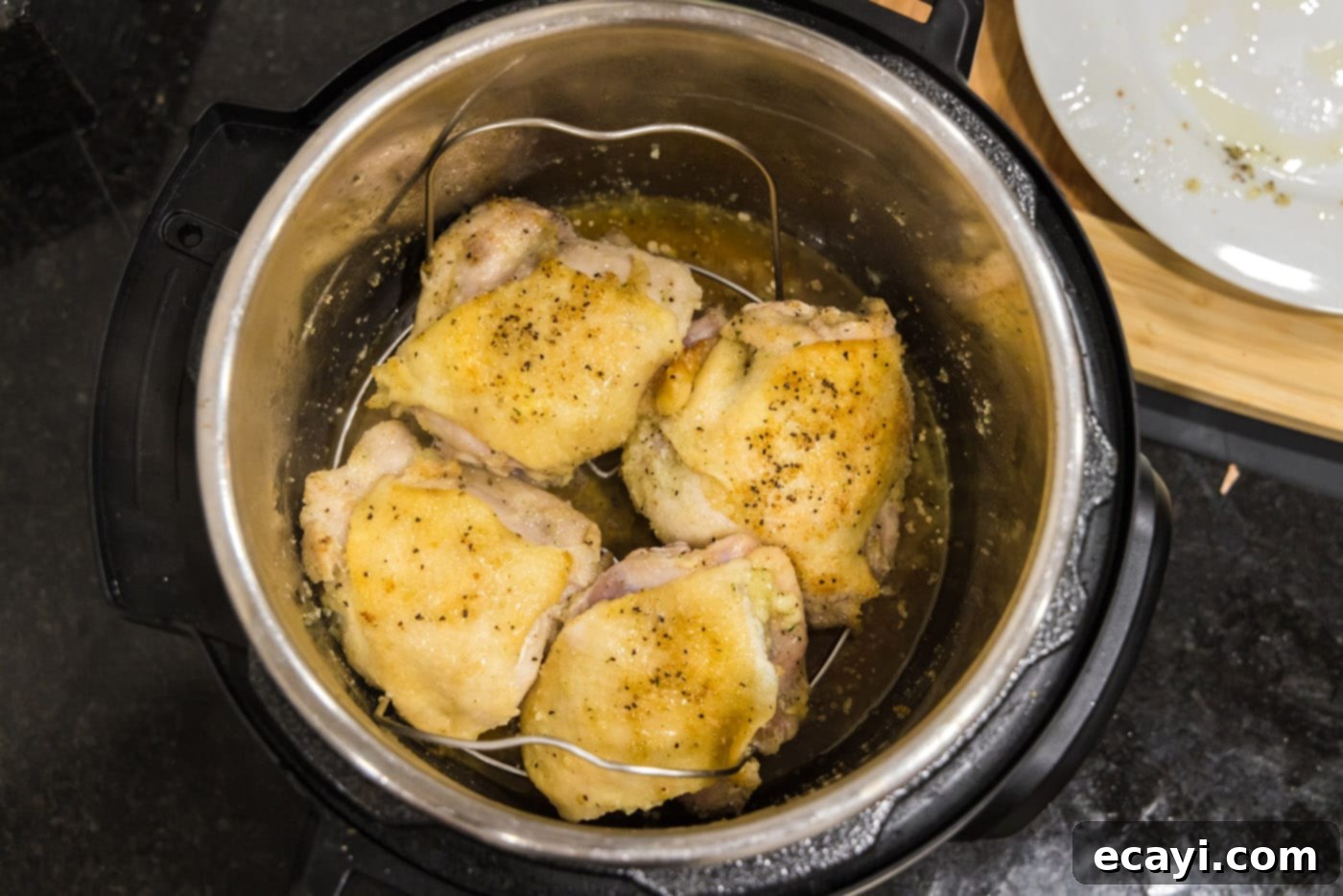 Effortless Instant Pot Chicken Thighs 11 chicken thighs on instant pot trivet
