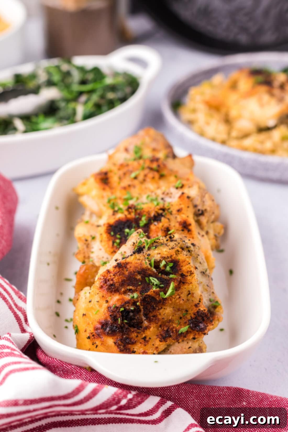 Effortless Instant Pot Chicken Thighs 3 Instant Pot Chicken Thighs in a serving dish
