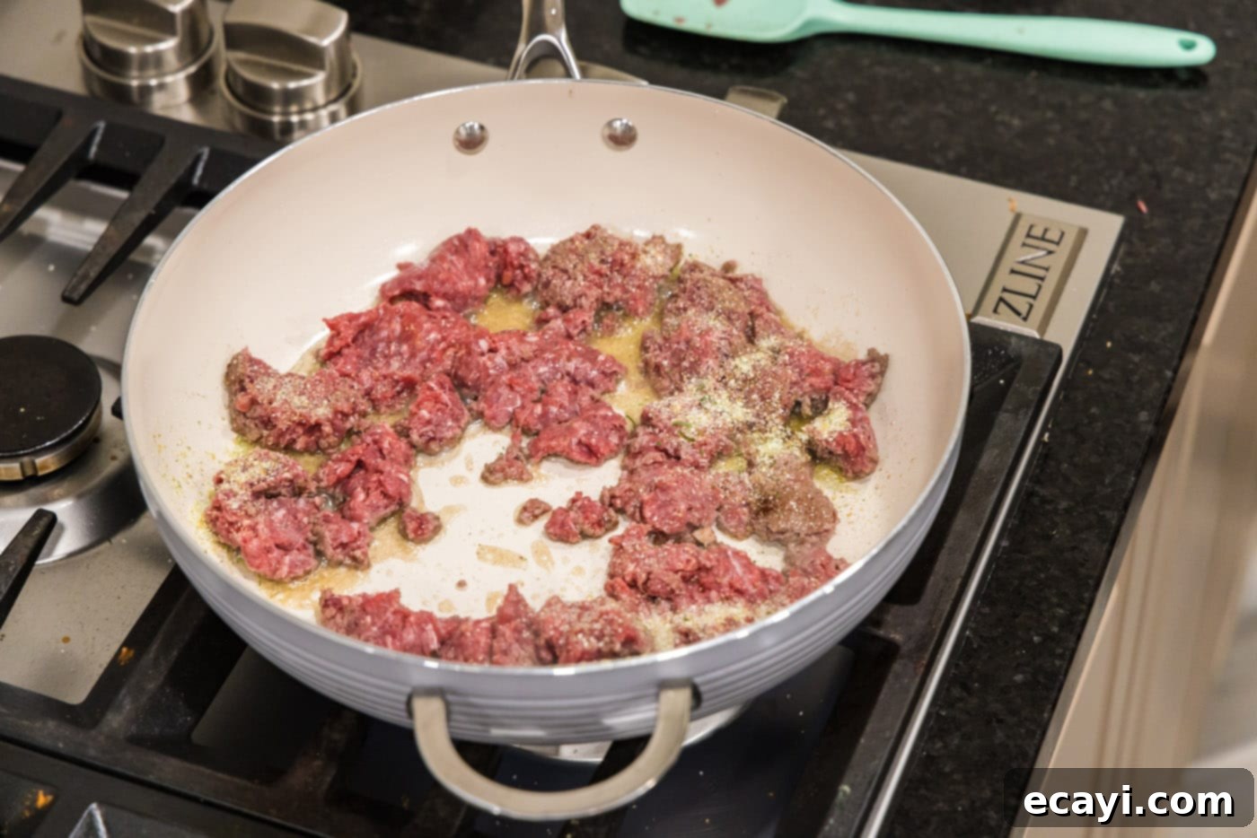 Tex-Mex Spaghetti 5 browning ground beef in a skillet with olive oil