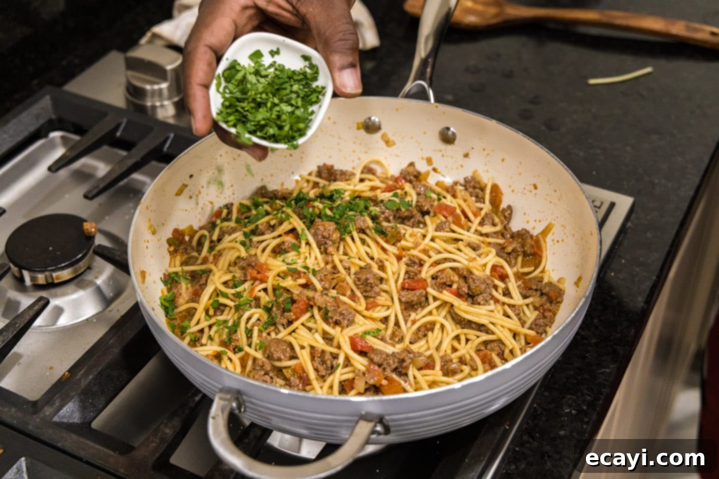 Tex-Mex Spaghetti 10 adding cilantro to taco spaghetti