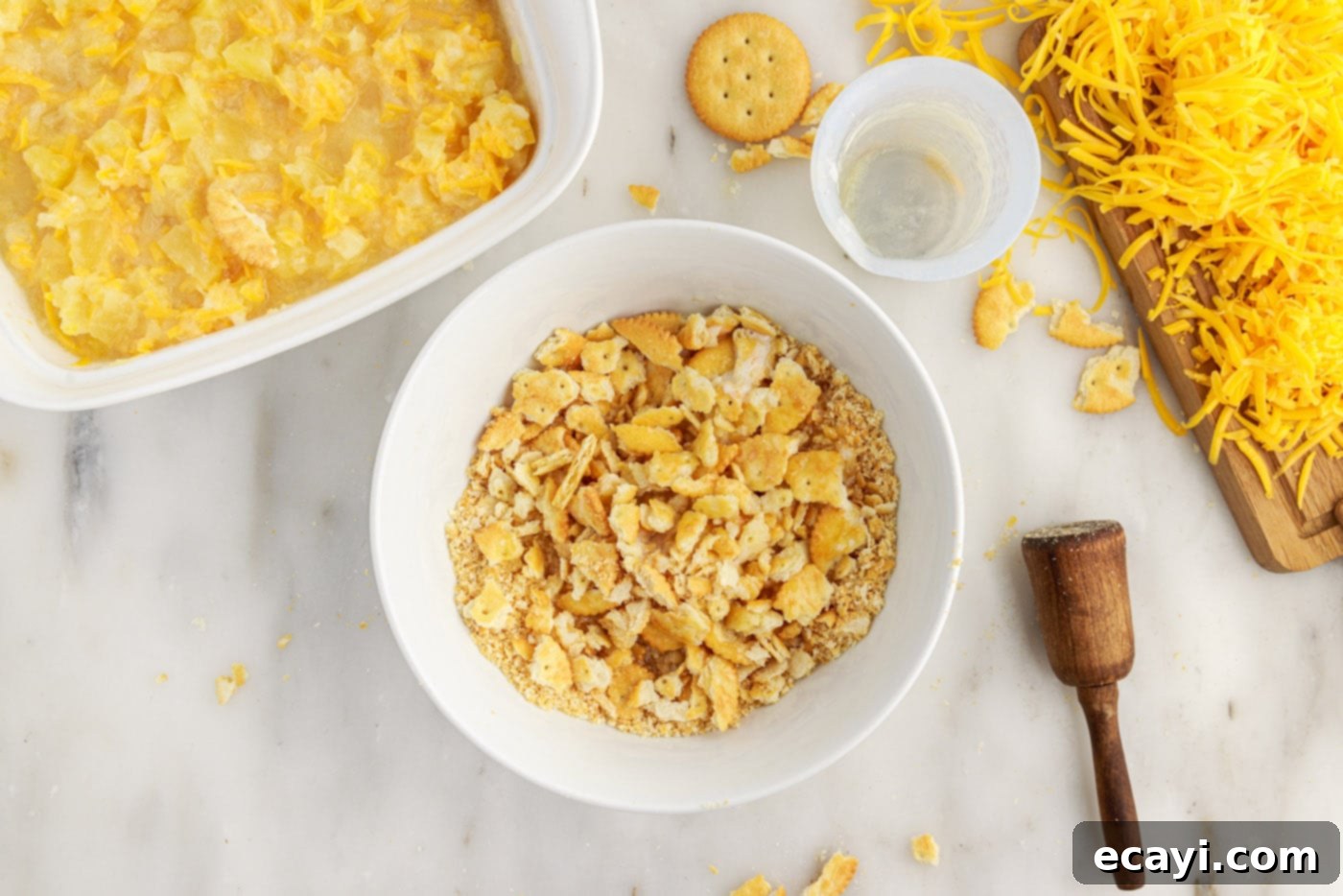 Sweet Pineapple Bake 8 crushed ritz crackers with melted butter in a bowl
