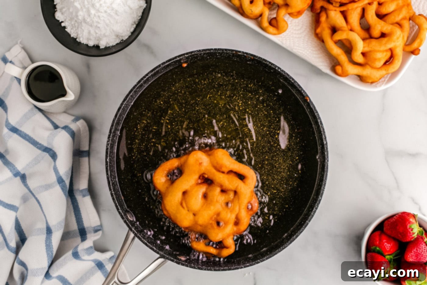 Carnival Classic: The Art of Funnel Cake 12 golden fried funnel cake in oil