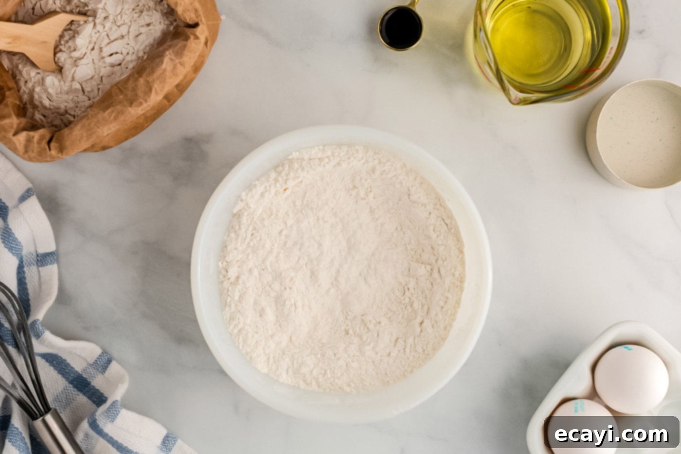 Carnival Classic: The Art of Funnel Cake 5 all-purpose flour, granulated sugar, baking powder, and salt whisked in a bowl