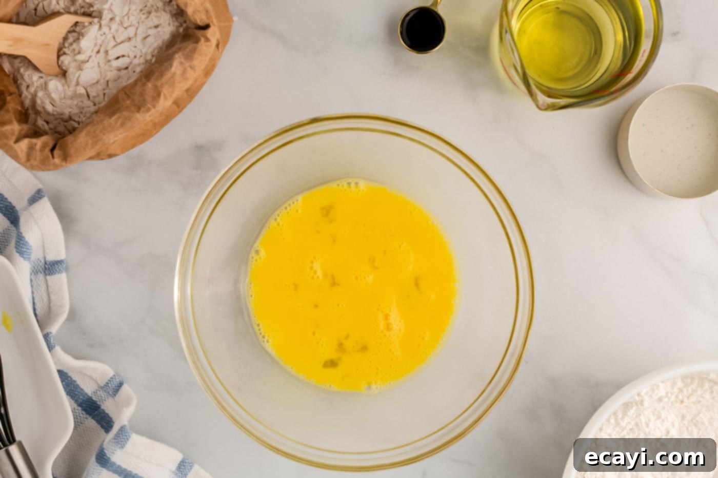Carnival Classic: The Art of Funnel Cake 6 whisked eggs in a bowl