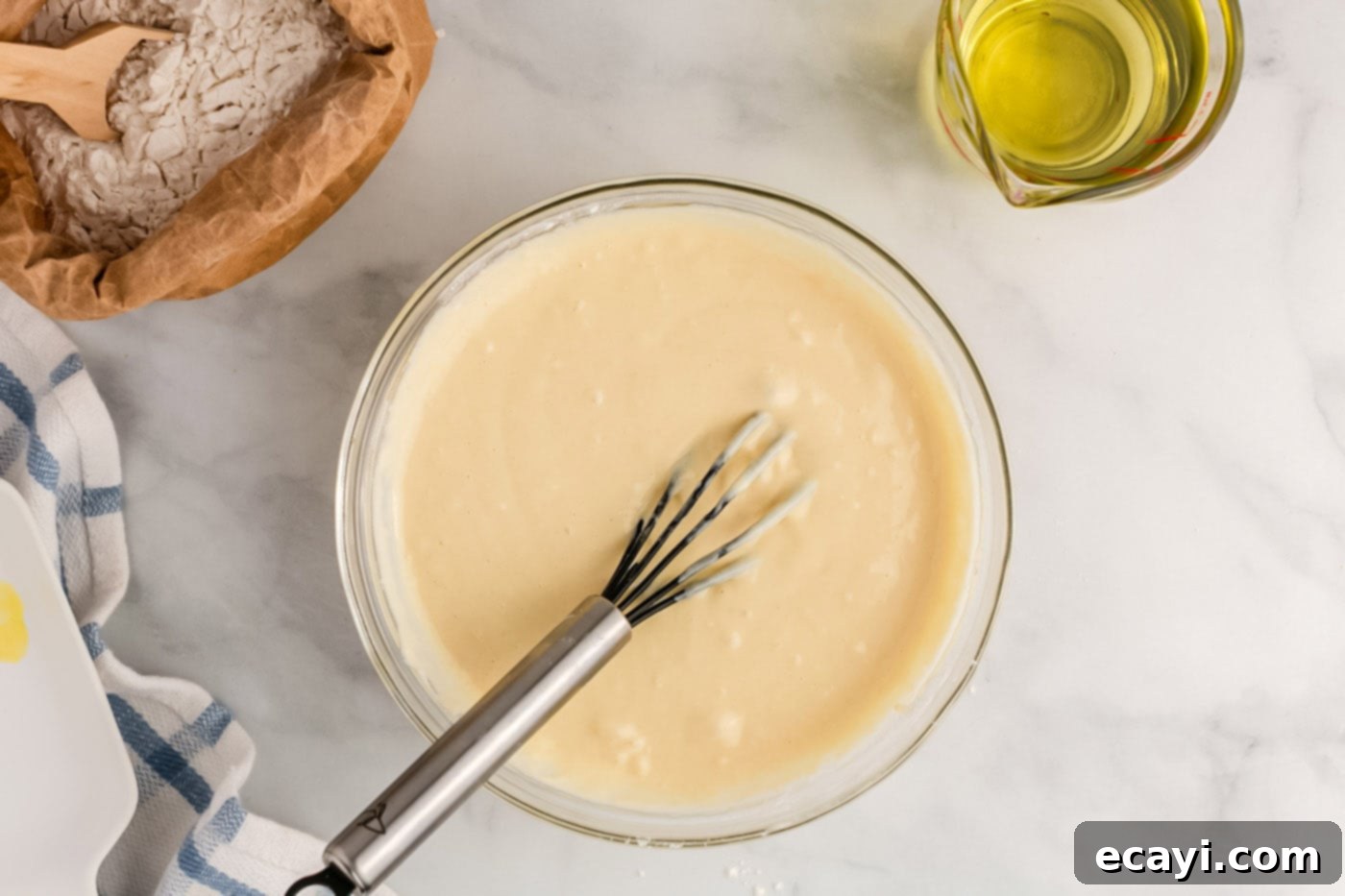 Carnival Classic: The Art of Funnel Cake 10 whisked funnel cake batter in a bowl