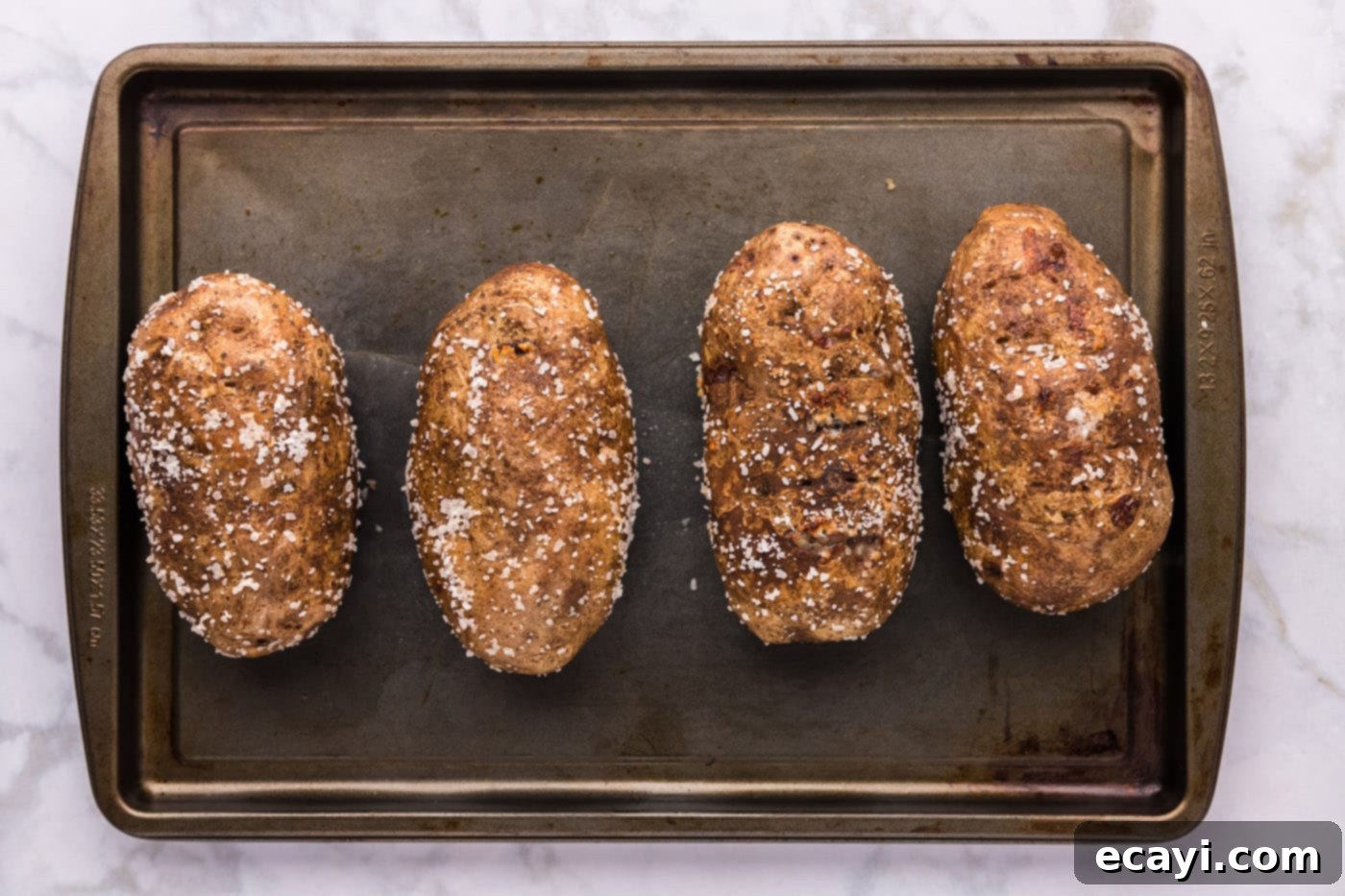 Baked Potato Perfection 8 crispy baked potatoes on a baking sheet