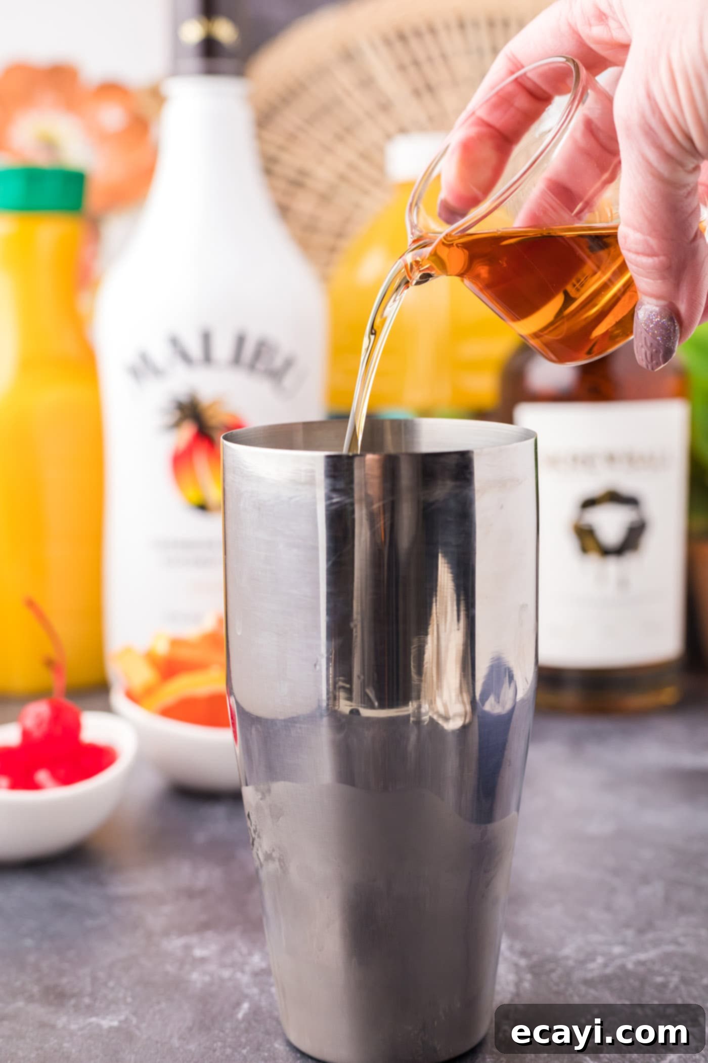 The Unhinged Sip 7 pouring peanut butter whiskey into cocktail shaker