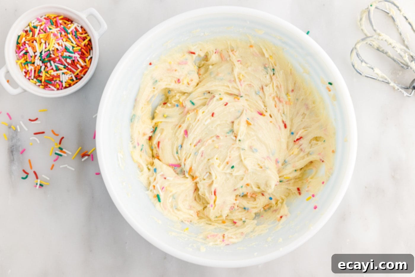 Easy Funfetti Cake Mix Cookies 6 Funfetti cake mix cookie dough batter, vibrant with colorful sprinkles, mixed and ready for scooping.