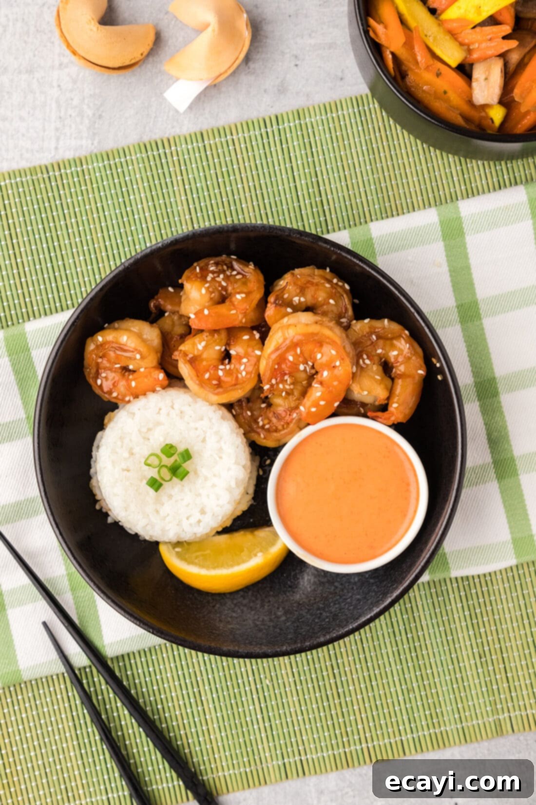 Sizzling Hibachi Shrimp 11 An inviting overhead view of a bowl of delicious Hibachi Shrimp, accompanied by fluffy rice and a generous serving of Yum Yum Sauce.