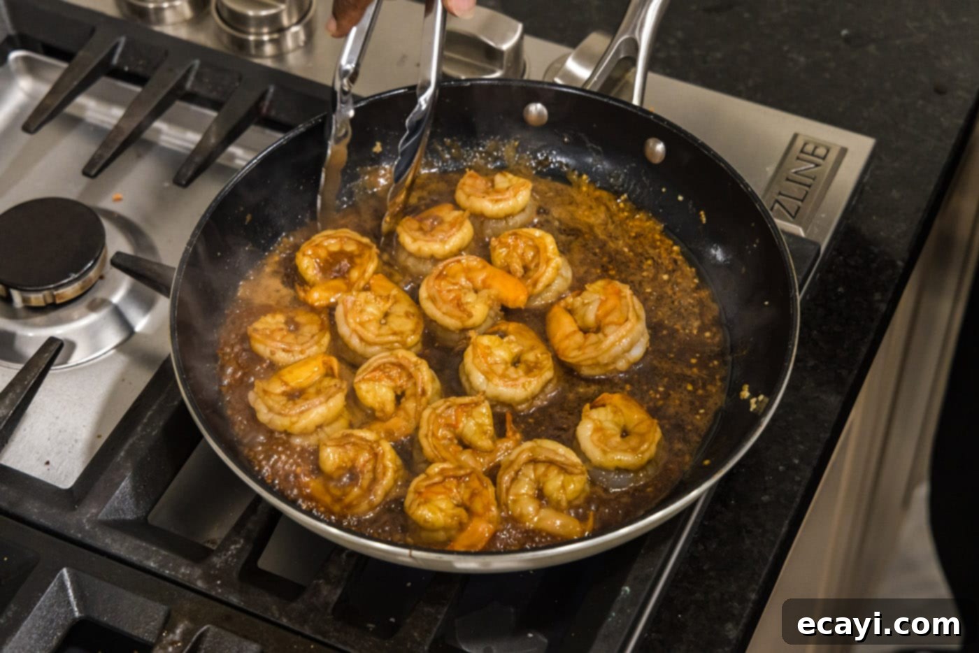 Sizzling Hibachi Shrimp 9 Perfectly pan-seared hibachi shrimp, golden-brown and glistening, resting in the skillet after cooking.
