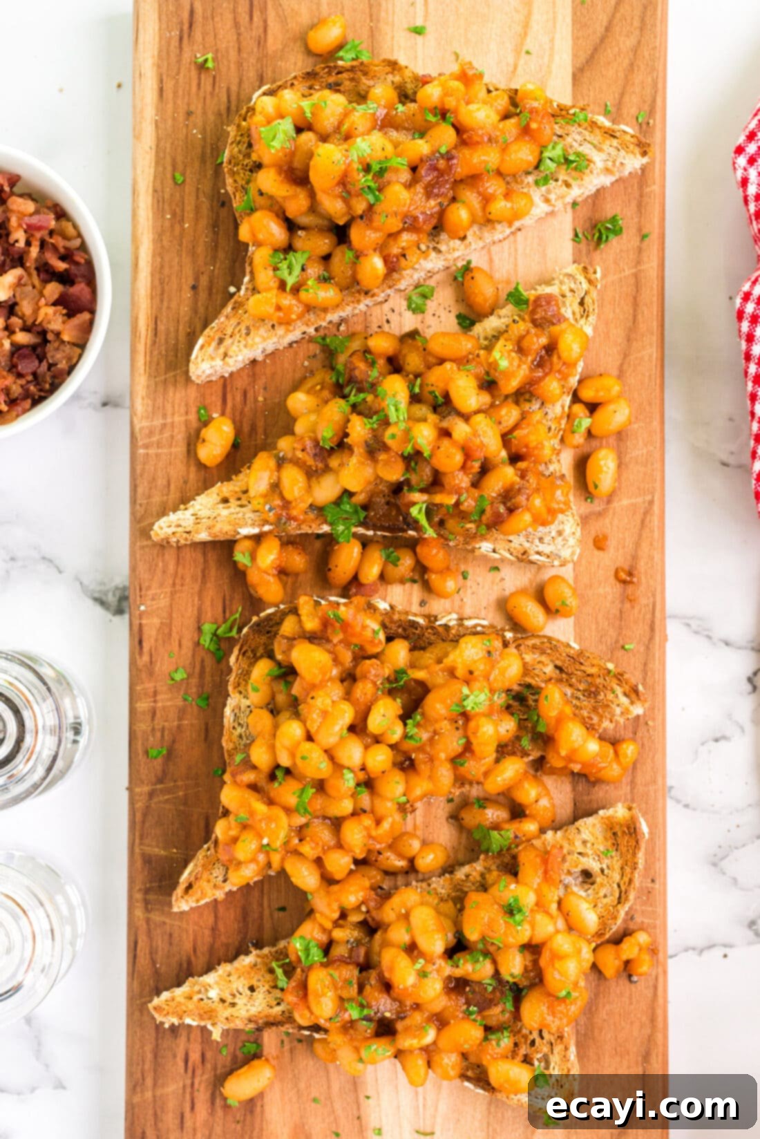 Hearty Beans, Crispy Toast 3 Overhead photo of Beans on Toast on a rustic wooden serving platter, a perfect easy meal